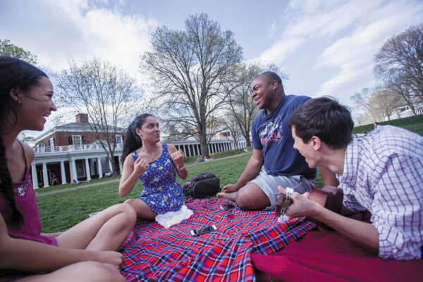 A group of students sitting on the Lawn