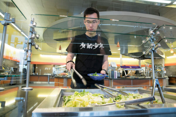 A student getting food in a dining hall