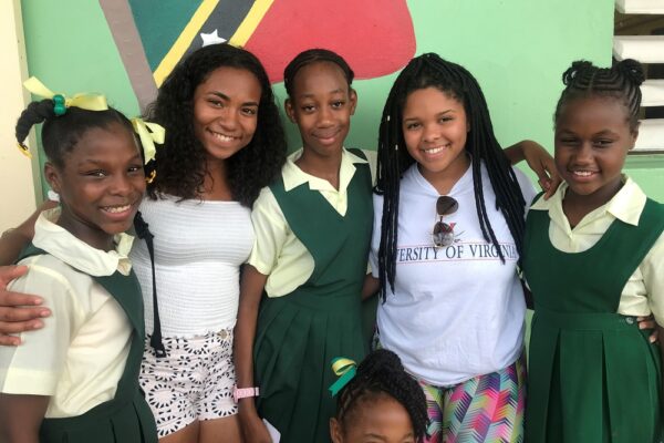 Sydney Williams with children in St. Kitts and Nevis